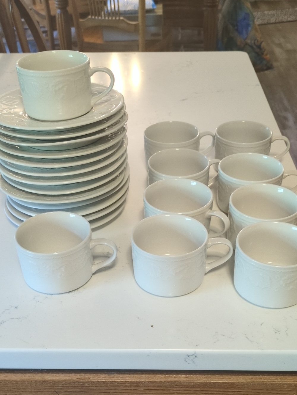 Vintage 10 Farberware Alsace teacups and 13 saucers. Embossed white.